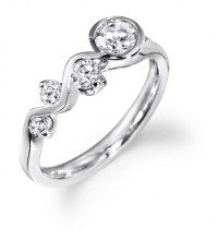 Swirl style four diamond ring